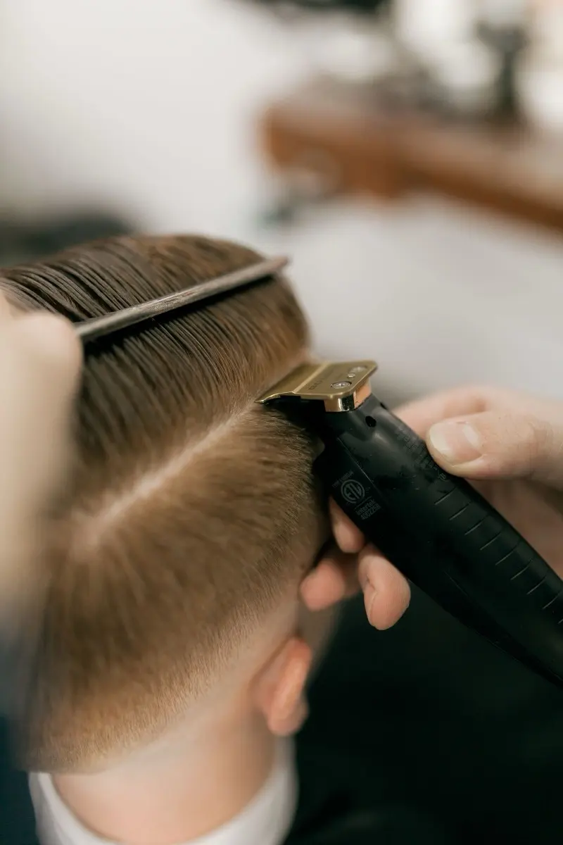 Clipper over comb through a sharp side part