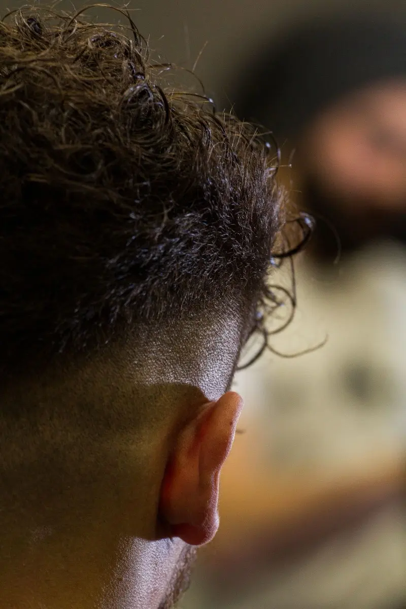 Textured crop with a clean taper, seen from behind