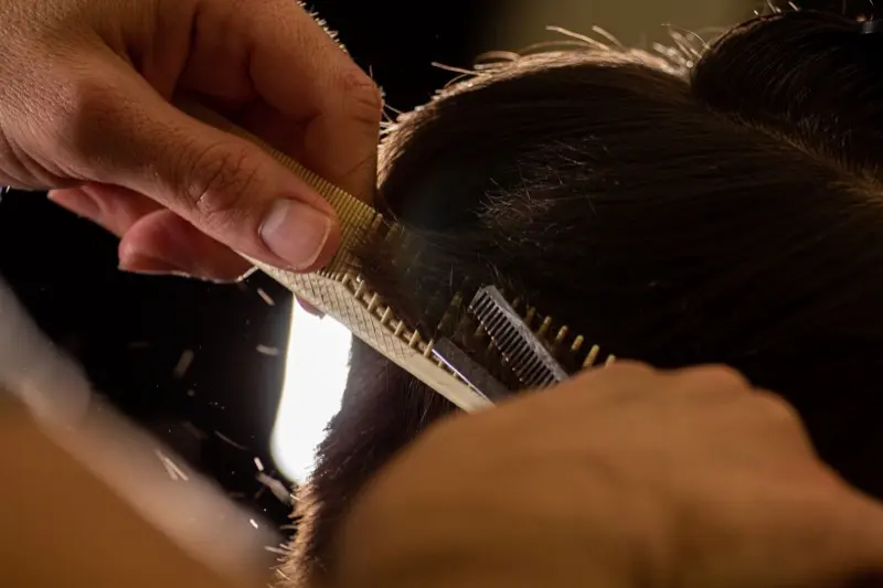 Scissor work over comb, backlit